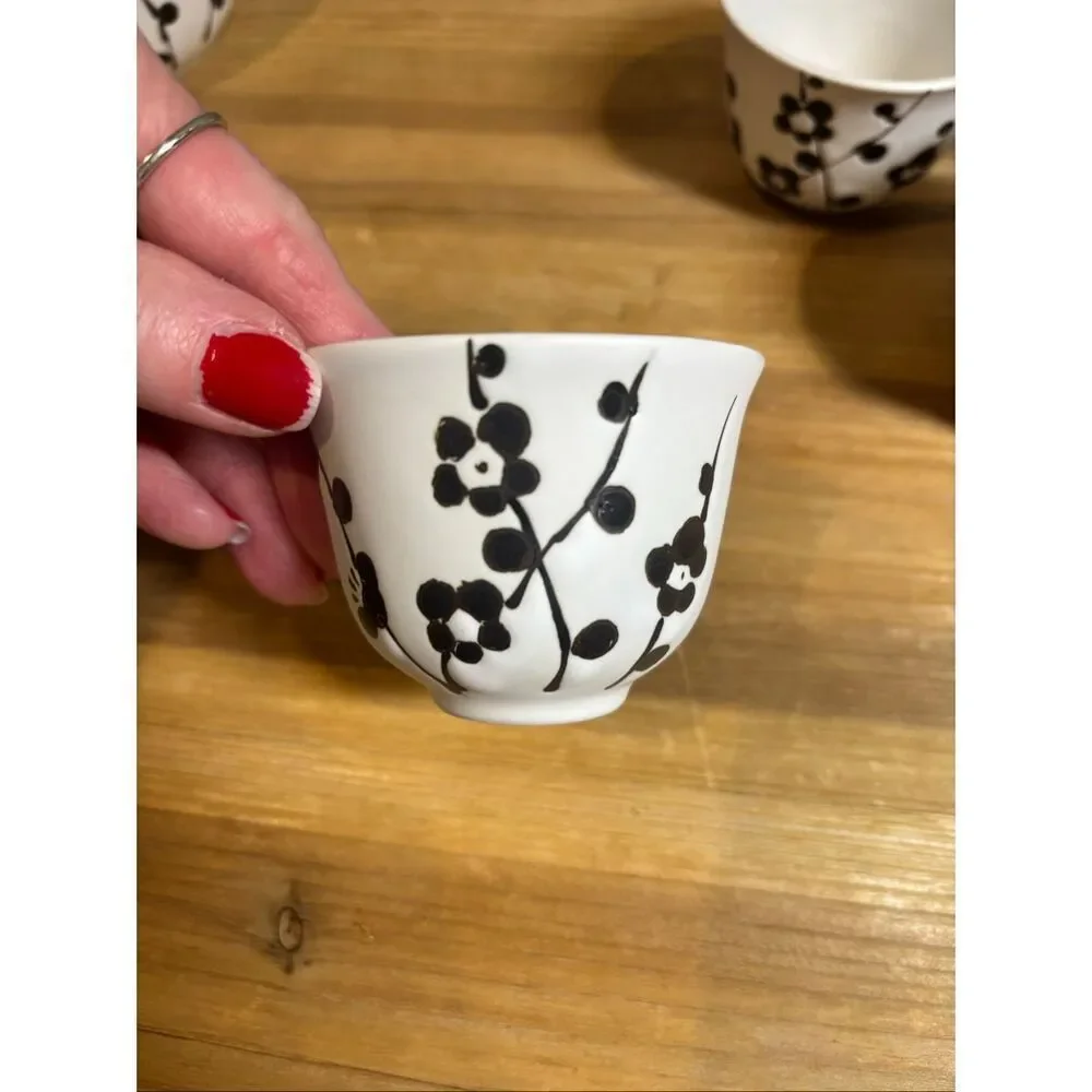 White ceramic tea pot and 4 tea cups with black cherry blossoms